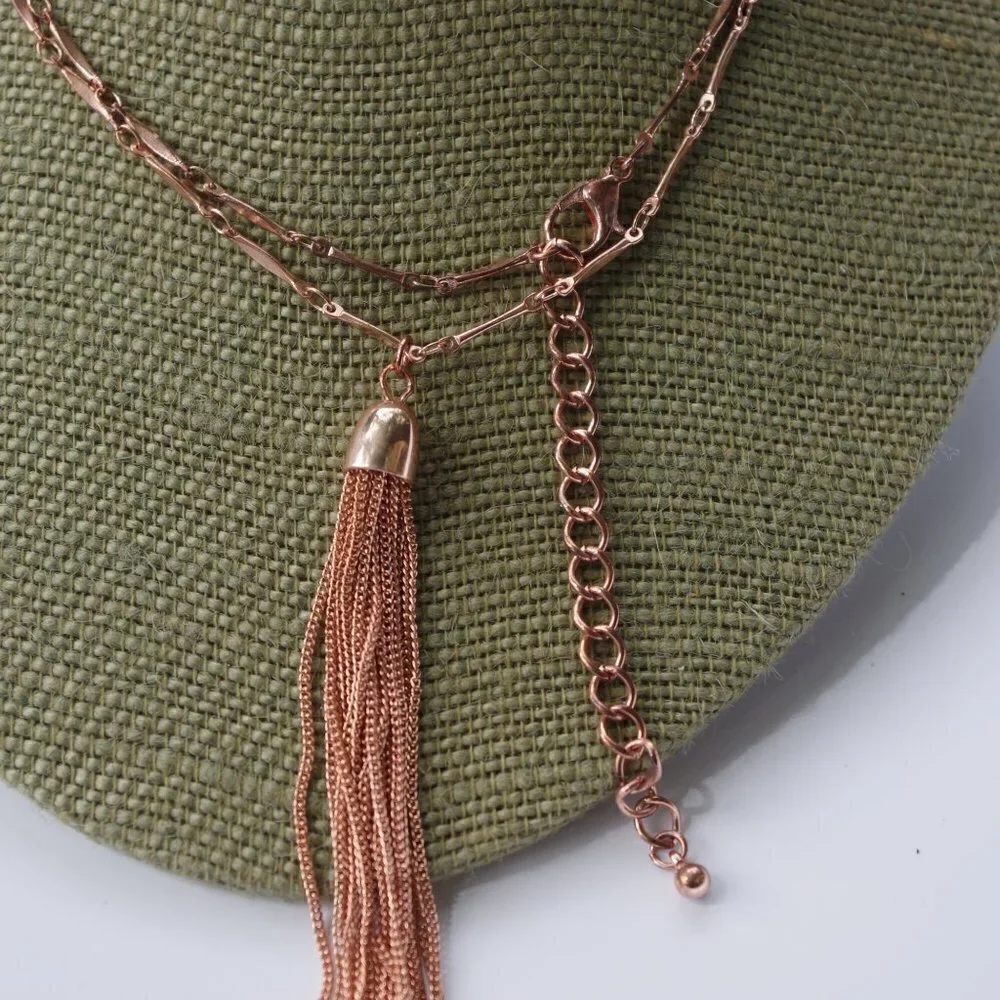 Women`s copper colored long tassel necklace.